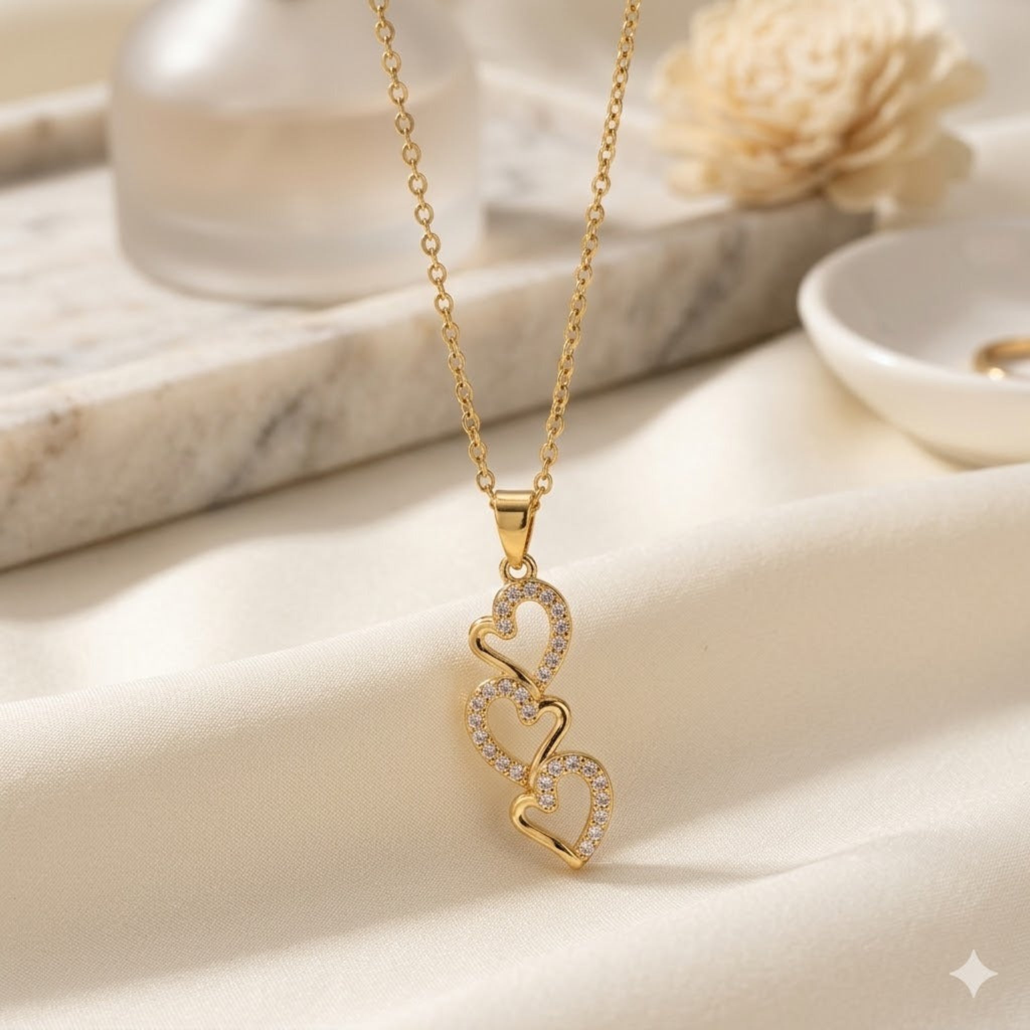 Endless Devotion: The Triple Interlocking Heart Necklace